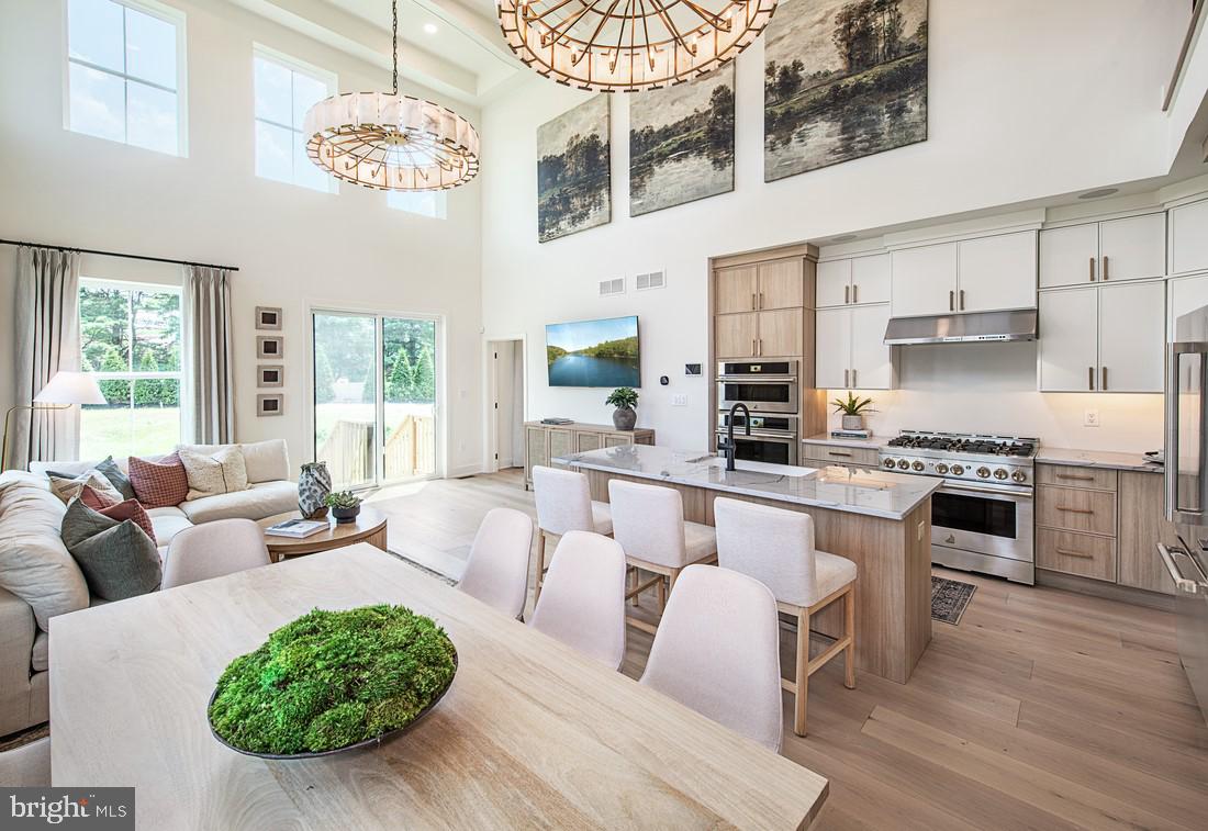 8 Cherry Lane Cranbury, NJ 08512 - Photo 4 of 15 a living room with furniture kitchen and a chandelier