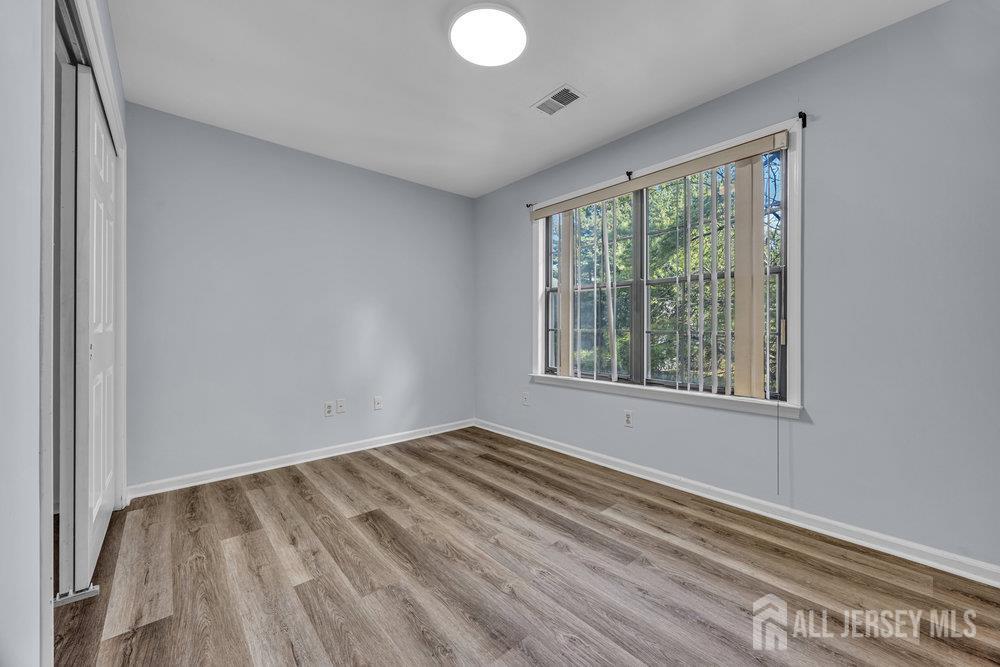 604 Woodhaven Drive Edison, NJ 08817 - Photo 18 of 38 a view of room with window and hardwood floor