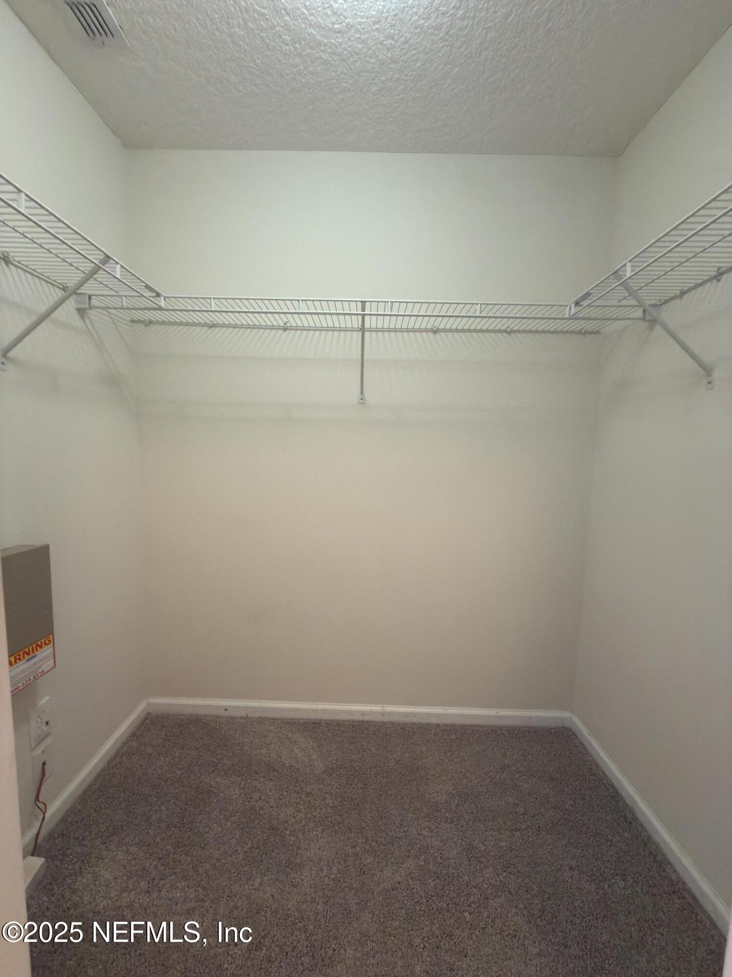1324 Wekiva Way St. Augustine, FL 32092 - Photo 14 of 42 a view of a room with racks on the wall