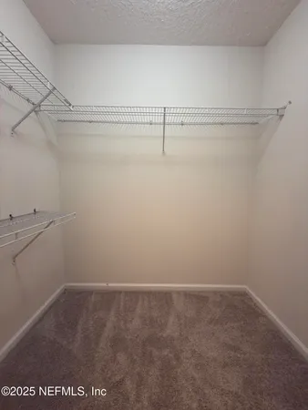 a view of a room with racks on the wall