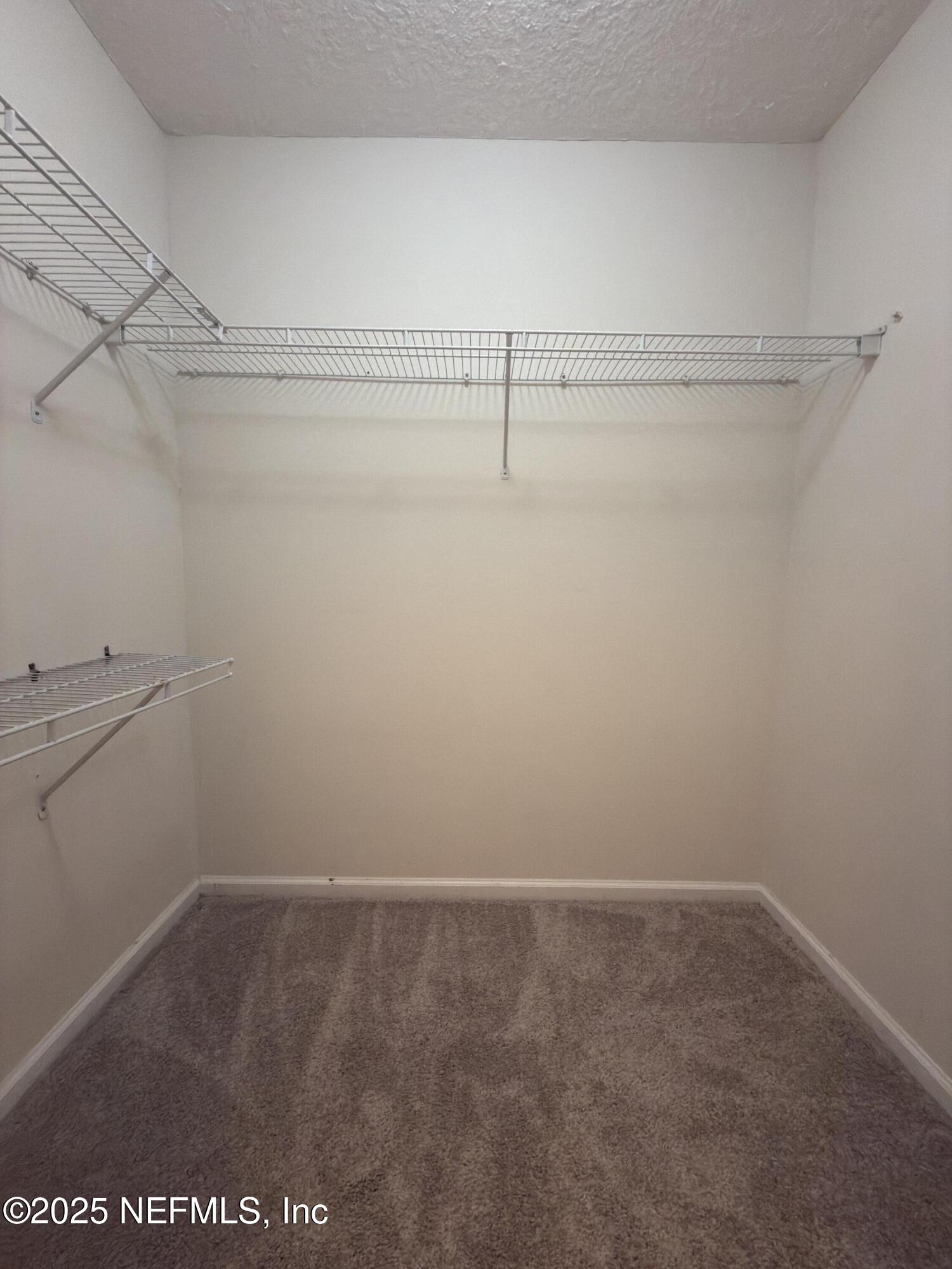 1324 Wekiva Way St. Augustine, FL 32092 - Photo 15 of 42 a view of a room with racks on the wall