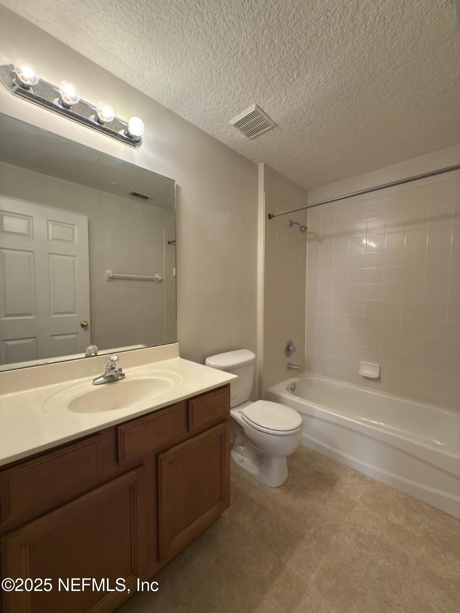 1324 Wekiva Way St. Augustine, FL 32092 - Photo 27 of 42 a bathroom with a double vanity sink toilet and shower