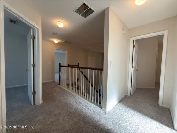 a view of a hallway with closet area