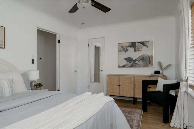 a bedroom with a bed and a table in it