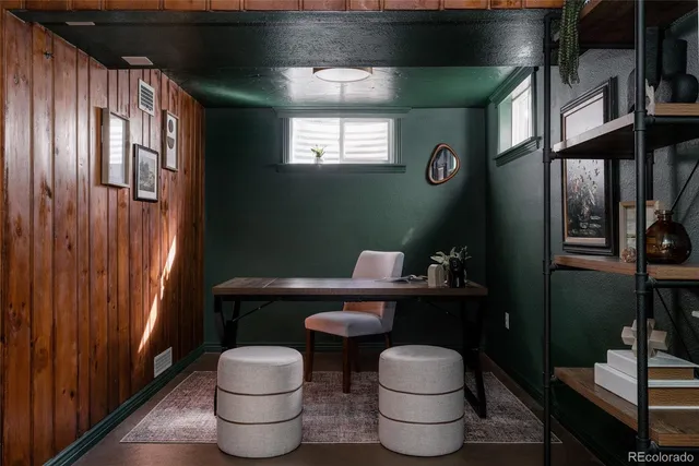 a bathroom with a toilet and a mirror