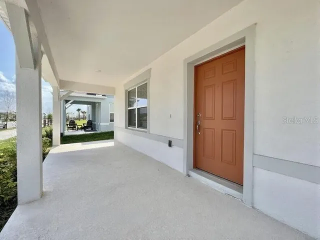 a view of a hallway with wooden shelves