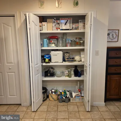a view of a refrigerator and lots of window