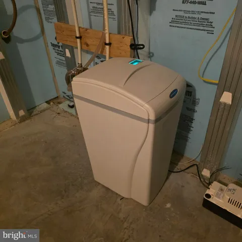 a swimming pool with lawn chairs and couch