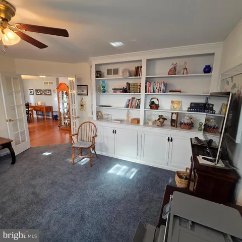 a workspace with furniture and white walls
