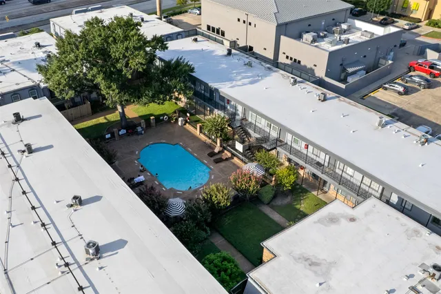 an aerial view of a house with a swimming pool