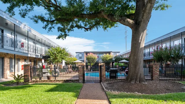 a front view of a building with a yard