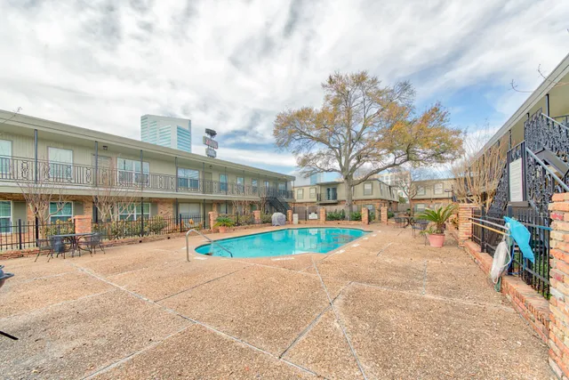 a view of swimming pool with outdoor seating