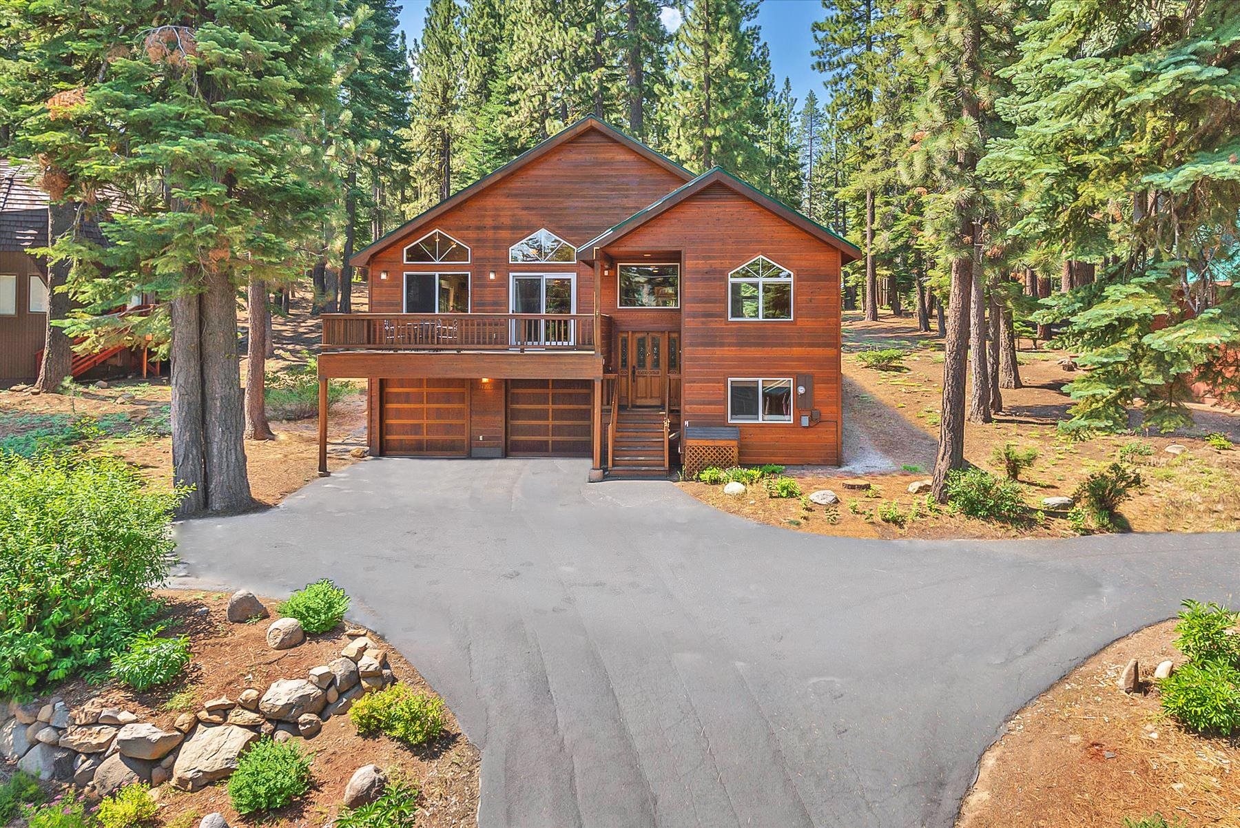 14265 Hansel Avenue Truckee, CA 96161 - Photo 1 of 21 a front view of a house with a yard and garage
