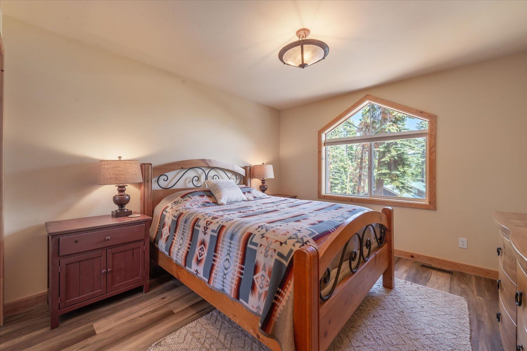 14265 Hansel Avenue Truckee, CA 96161 - Photo 11 of 21 a bedroom with a bed next to a window