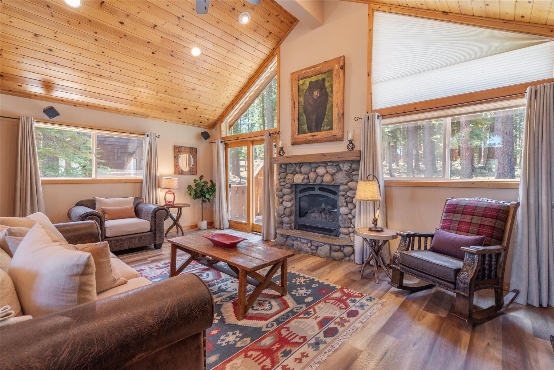 14265 Hansel Avenue Truckee, CA 96161 - Photo 4 of 21 a living room with furniture a fireplace and a table