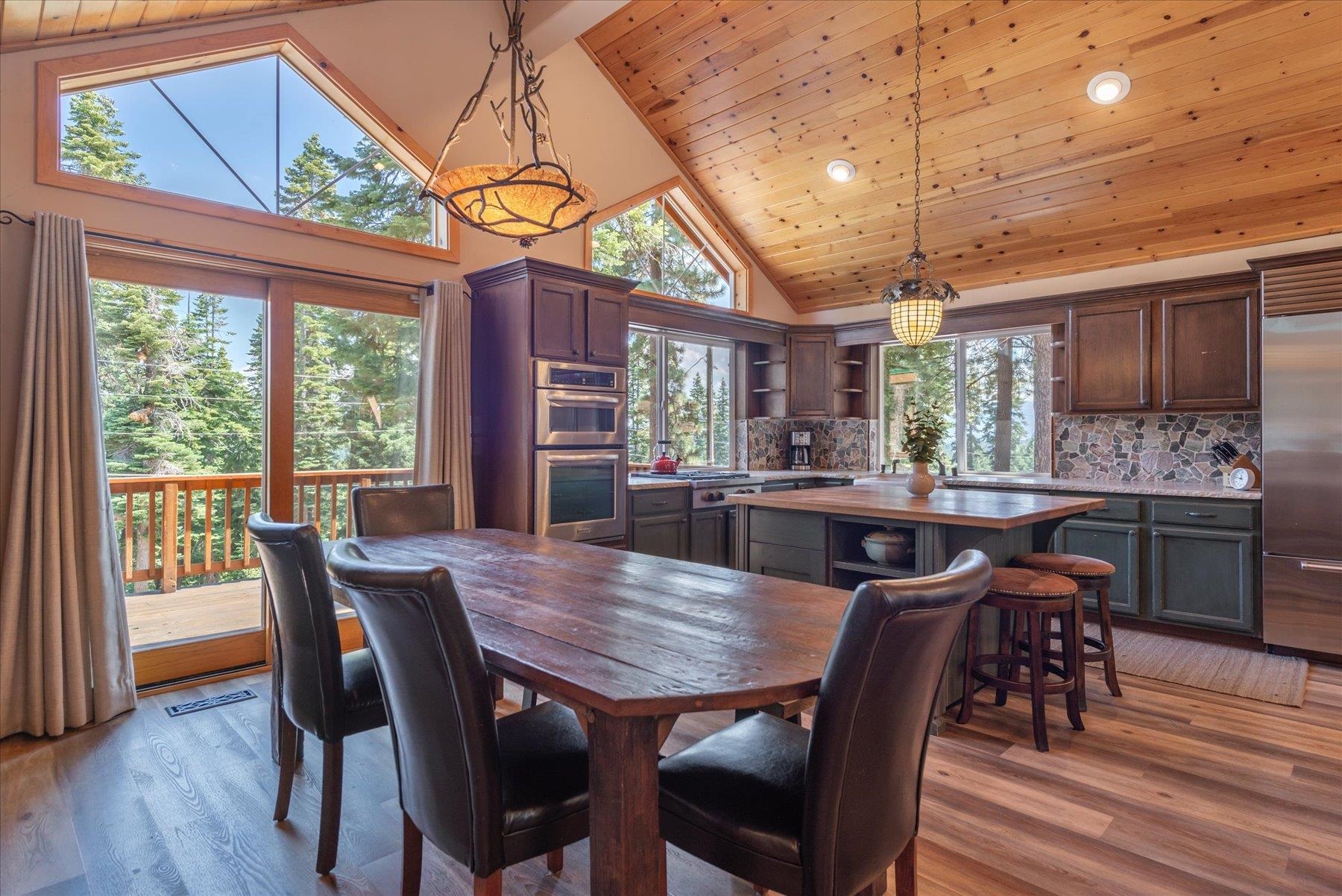 14265 Hansel Avenue Truckee, CA 96161 - Photo 7 of 21 a view of a dining room with furniture window and wooden floor