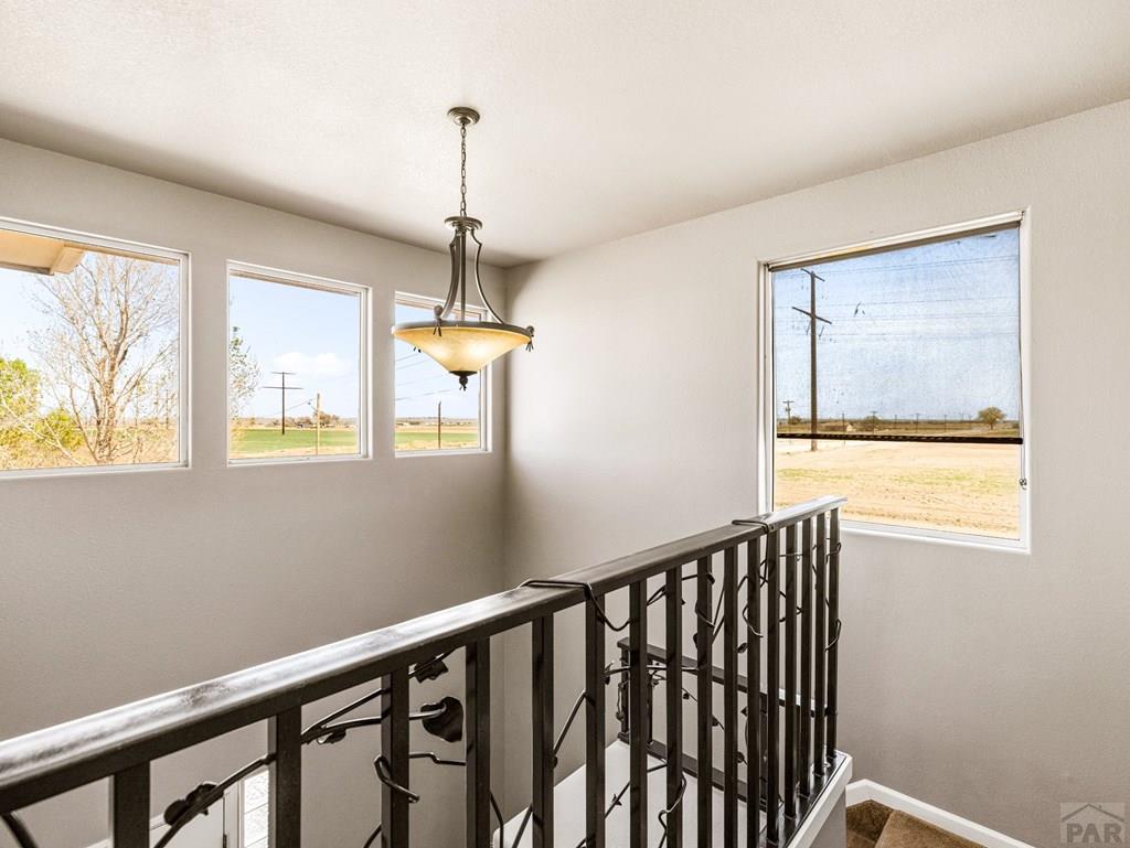 43948 Hunsaker Road Avondale, CO 81022 - Photo 18 of 56 a view of a hallway with windows