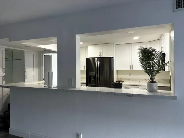 front view of a house with a large window