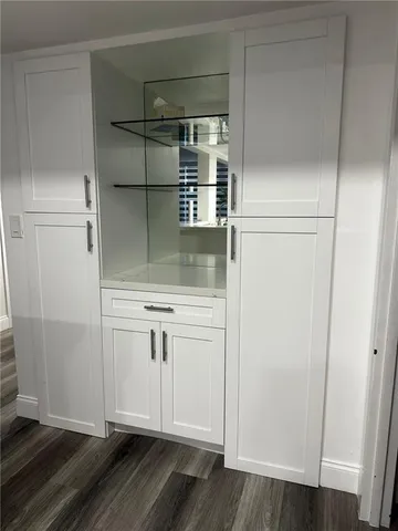a view of cabinets and wooden floor