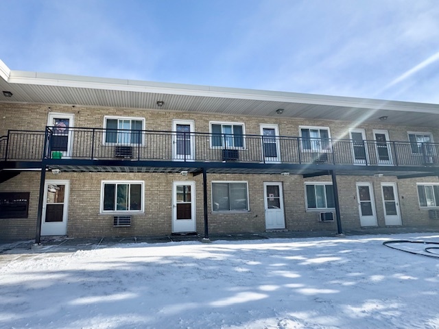 a front view of residential houses with yard