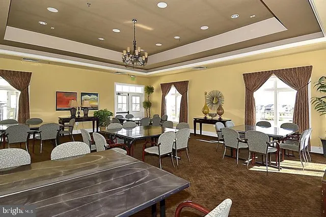 a living room with lots of furniture and a chandelier