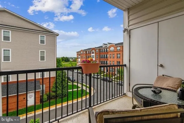 a view of a balcony with furniture