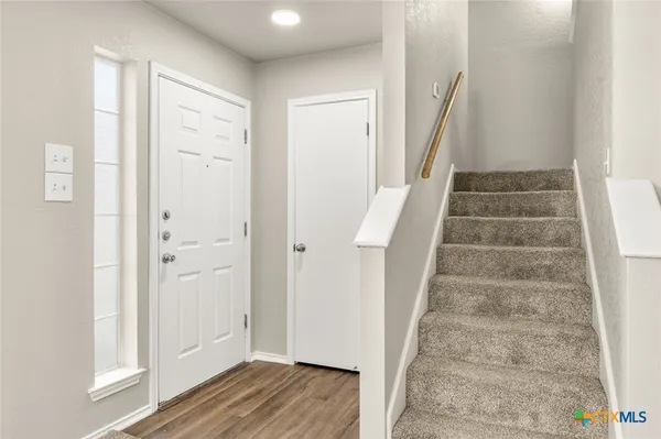 a view of an entryway with stairs