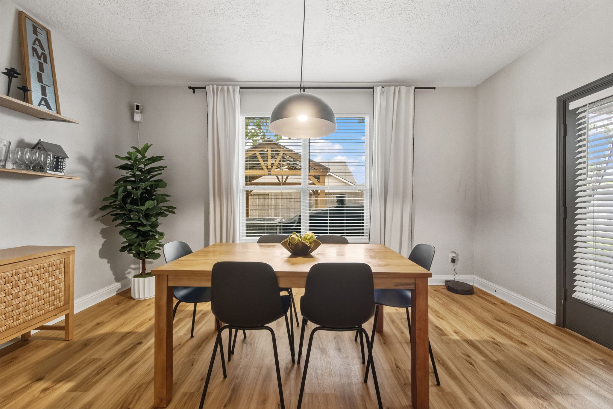29631 Legends Line Drive Spring, TX 77386 - Photo 13 of 35 a view of a dining room with furniture window and wooden floor