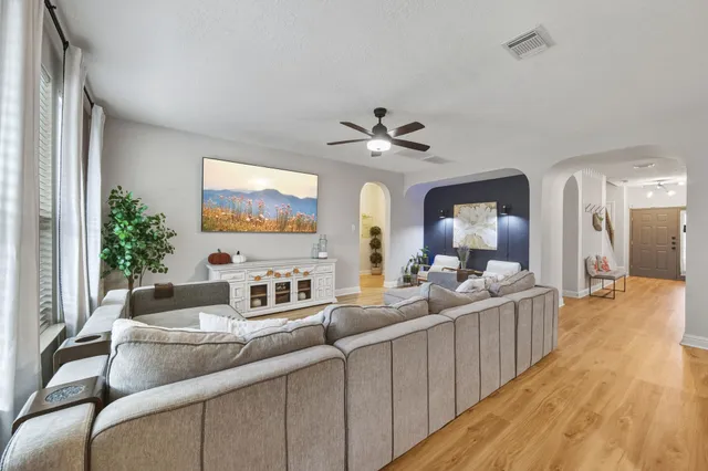 a living room with furniture and a rug