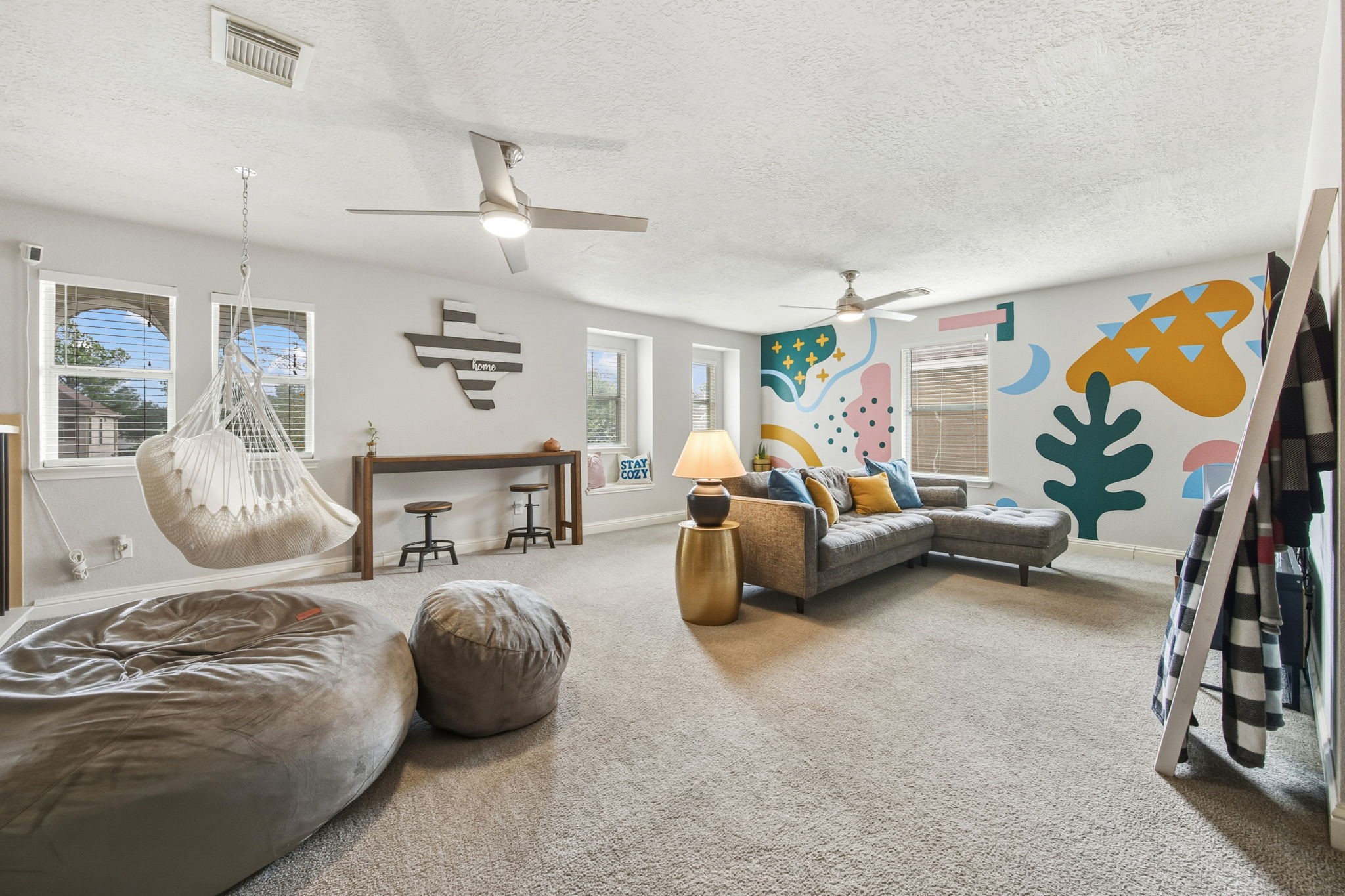 29631 Legends Line Drive Spring, TX 77386 - Photo 19 of 35 a bedroom with furniture and a chandelier