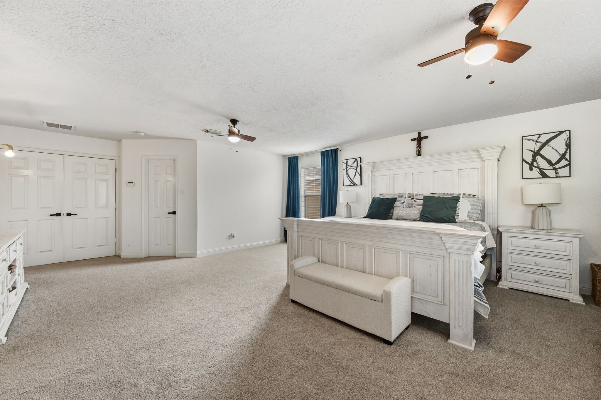 29631 Legends Line Drive Spring, TX 77386 - Photo 23 of 35 a bedroom with a white bed and ceiling fan