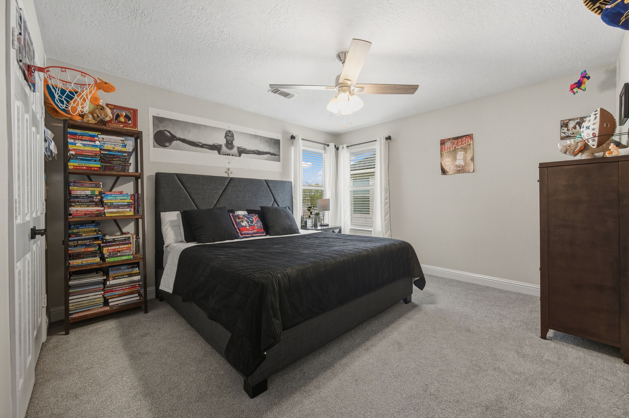 29631 Legends Line Drive Spring, TX 77386 - Photo 27 of 35 a bedroom with a bed and a walk in closet