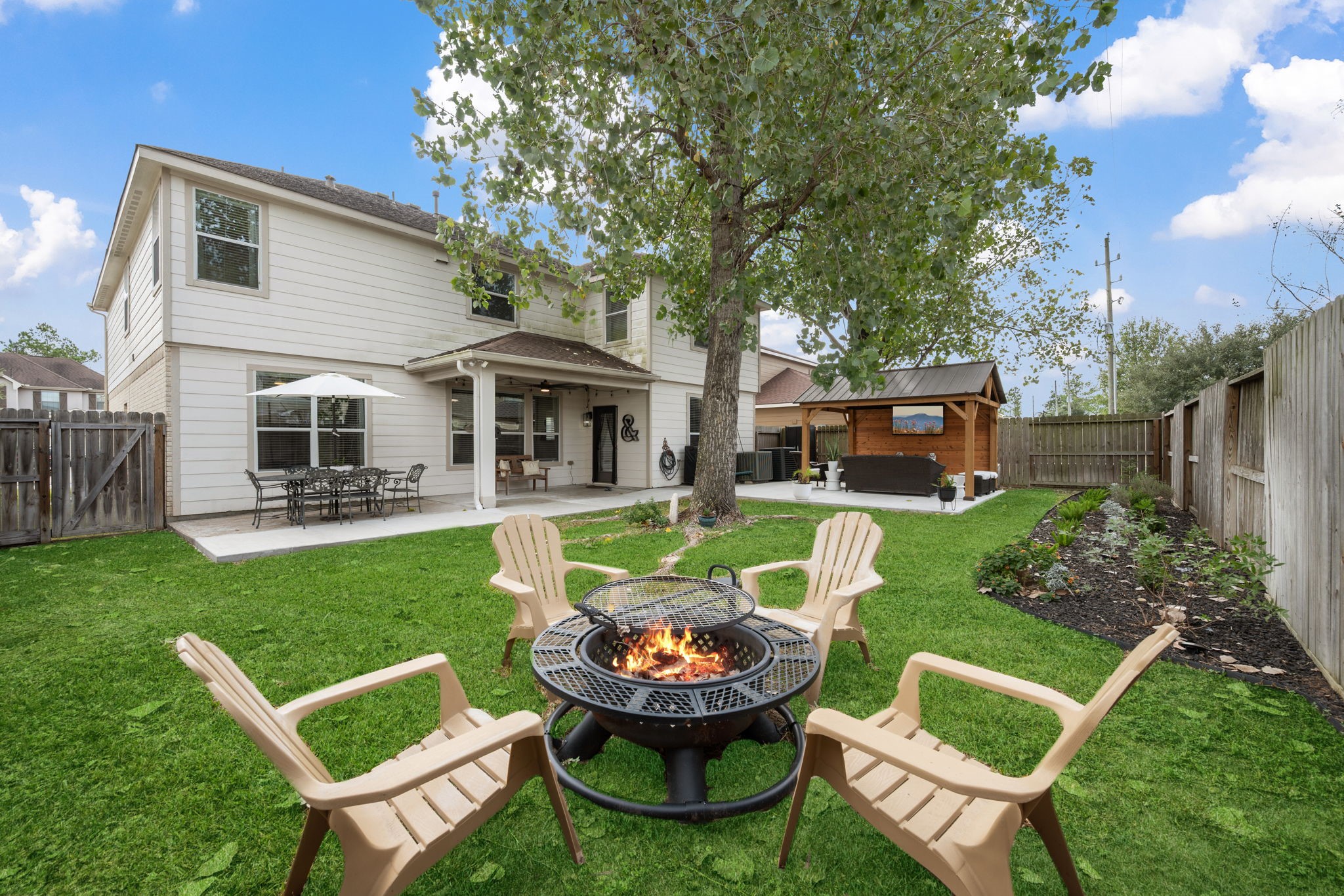 29631 Legends Line Drive Spring, TX 77386 - Photo 4 of 35 a swimming pool with outdoor seating and yard