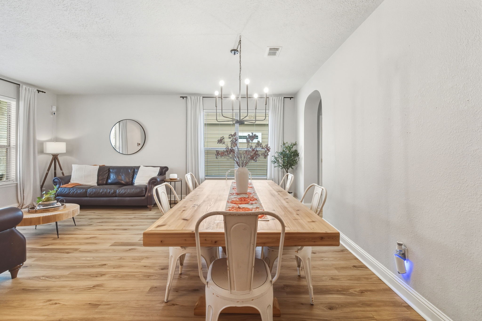 29631 Legends Line Drive Spring, TX 77386 - Photo 9 of 35 a view of a dining room with furniture a chandelier and wooden floor