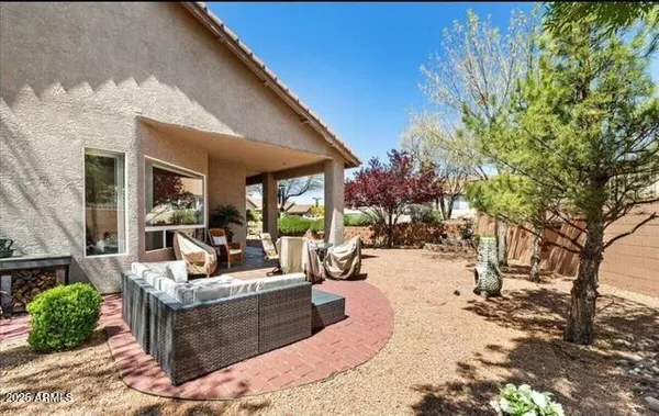 a view of a patio with couches and potted plants