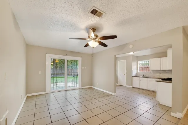 a view of a kitchen with a sink and a window