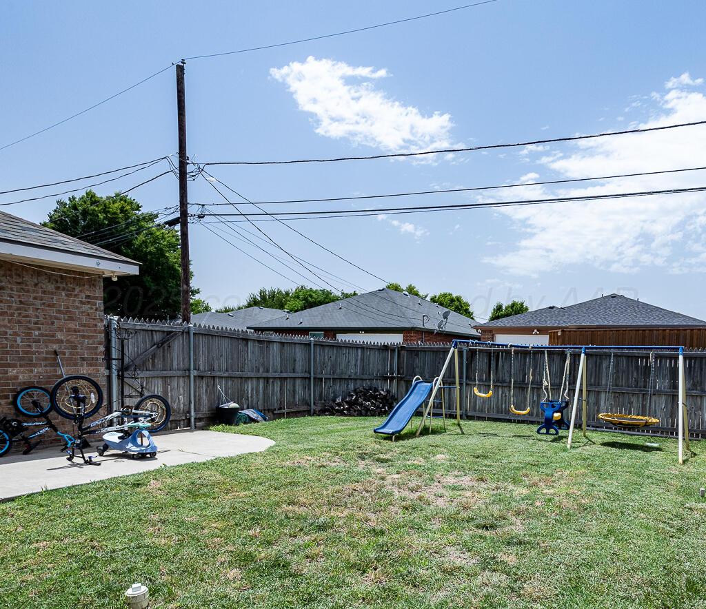 4808 Mammoth Lane Amarillo, TX 79110 - Photo 14 of 15 a view of a house with a backyard and furniture