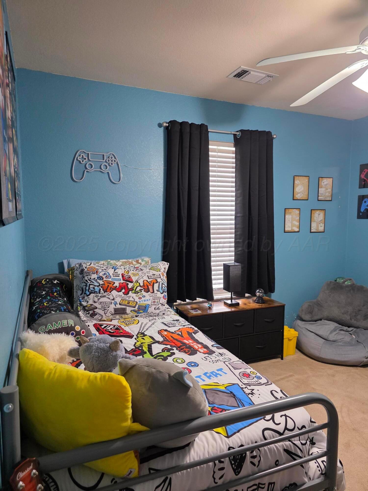 4808 Mammoth Lane Amarillo, TX 79110 - Photo 7 of 15 a bedroom with bed and windows