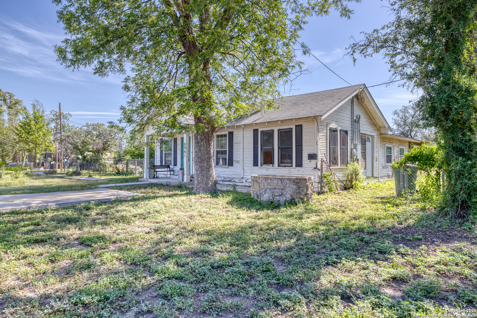 806 South Park Street Uvalde, TX 78801 - Photo 18 of 25 a front view of a house with yard and trees