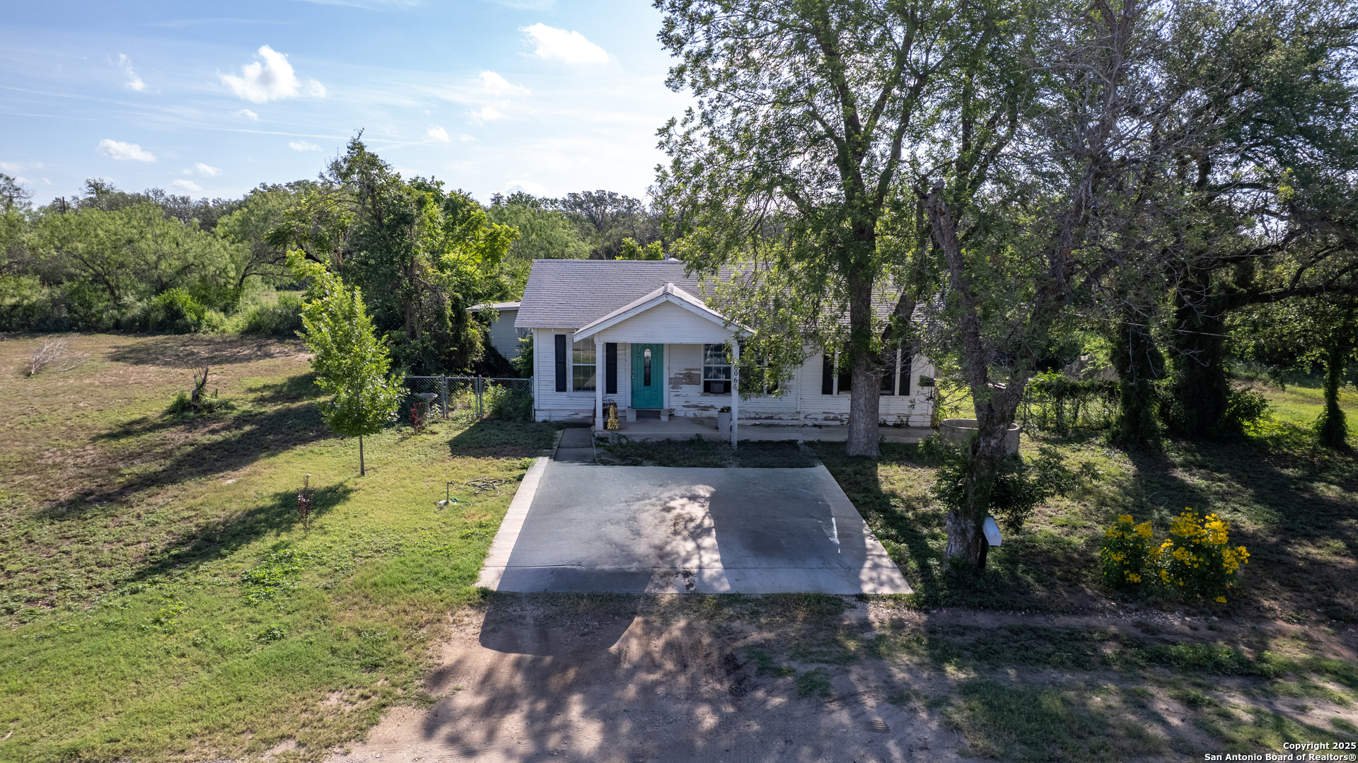 806 South Park Street Uvalde, TX 78801 - Photo 19 of 25 a front view of a house with garden