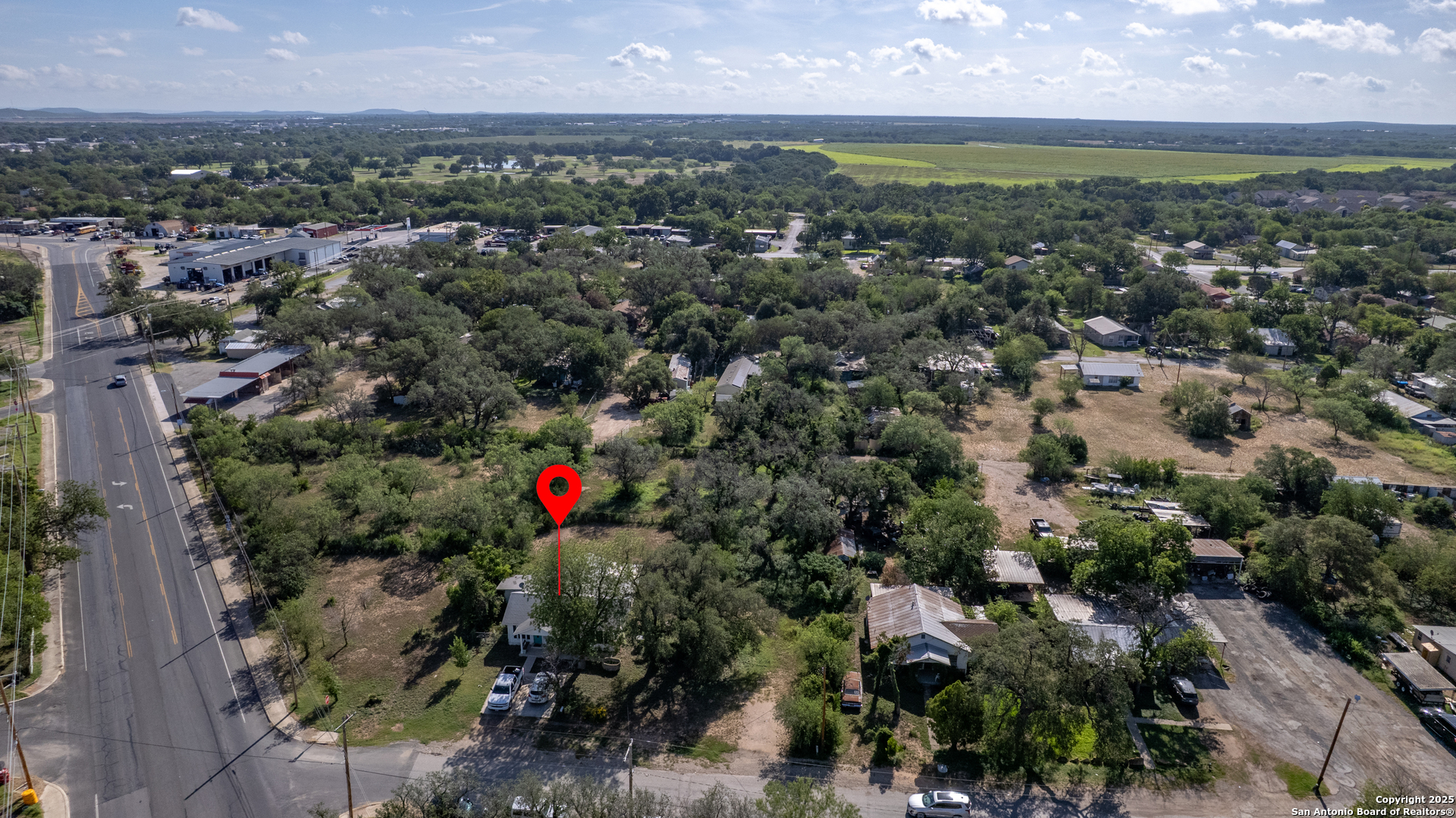 806 South Park Street Uvalde, TX 78801 - Photo 21 of 25 an aerial view of residential houses with outdoor space and trees