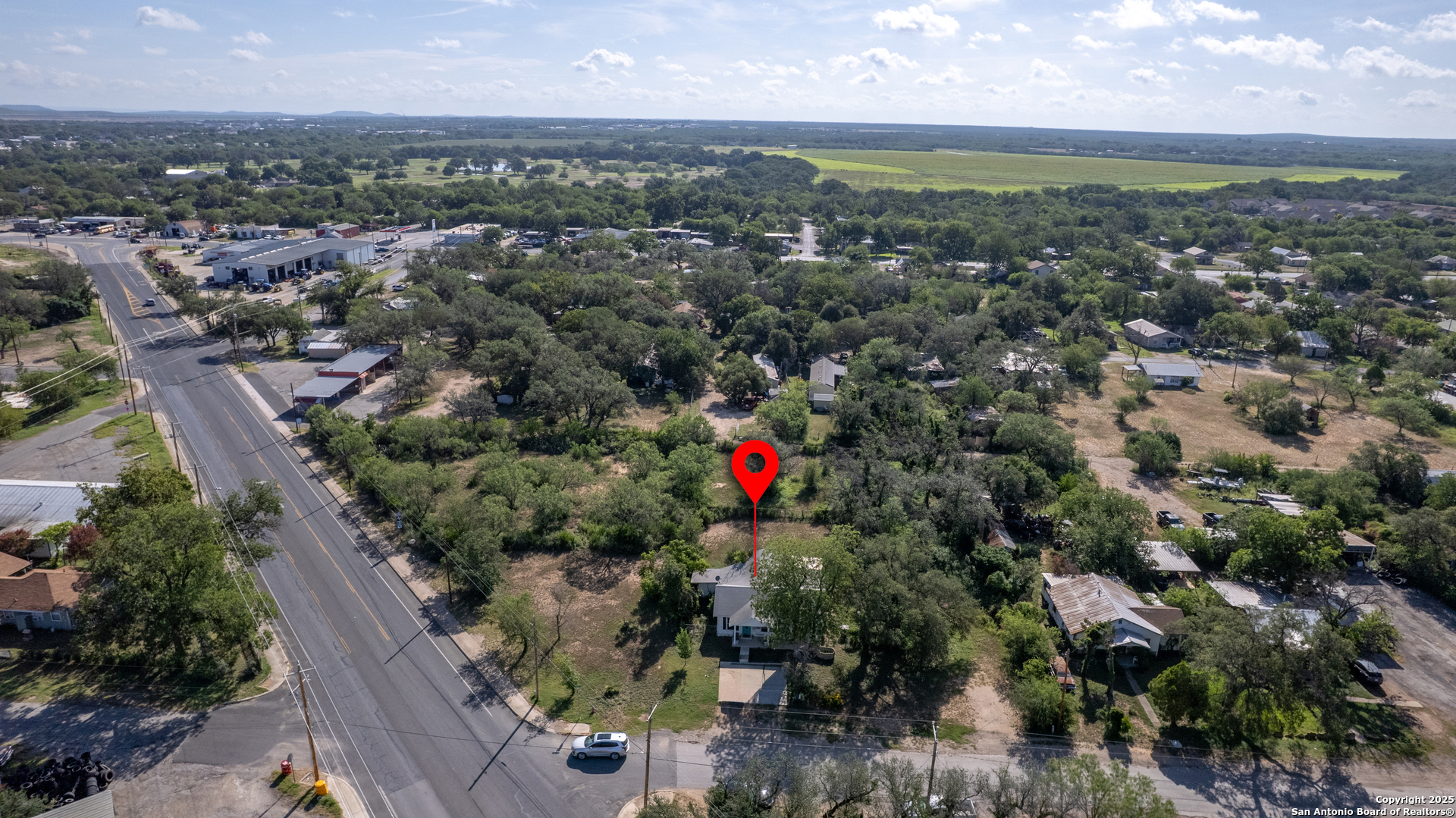 806 South Park Street Uvalde, TX 78801 - Photo 22 of 25 an aerial view of a houses with a yard