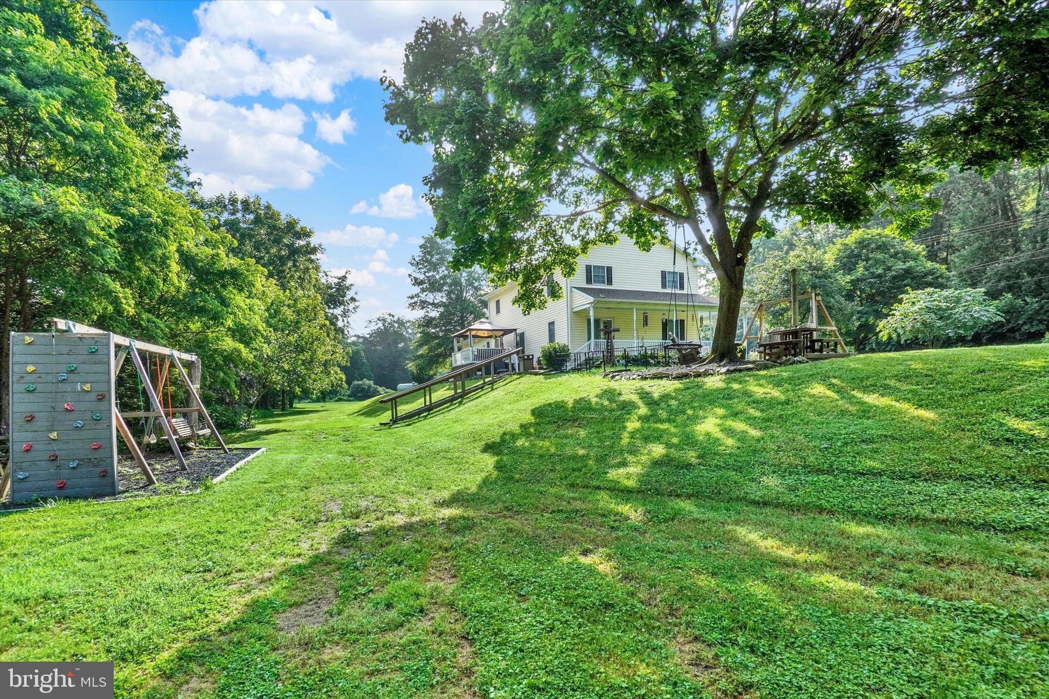 1665 Craley Road Windsor, PA 17366 - Photo 51 of 69 a view of a house with a yard and sitting area