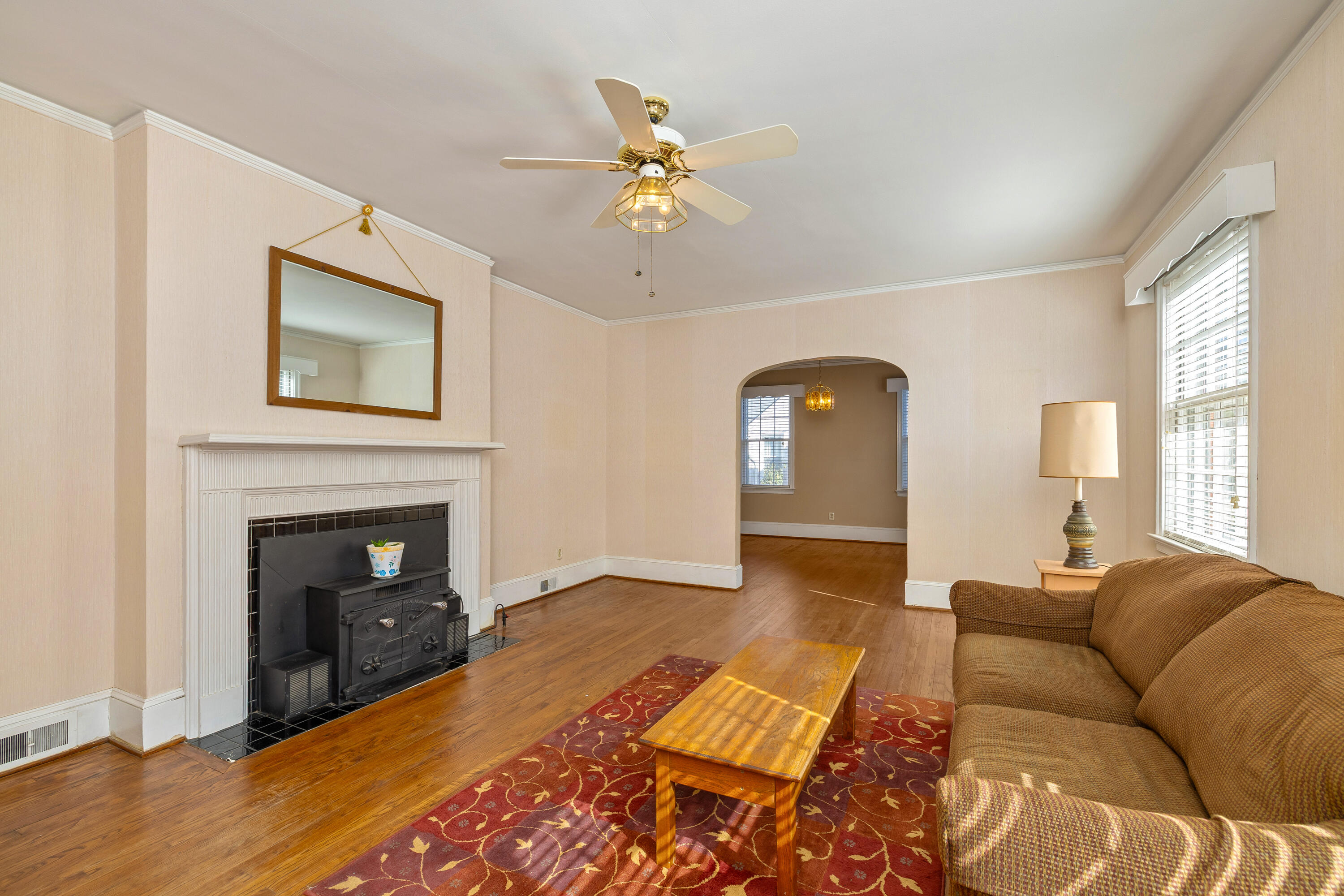 537 West Calhoun Street Sumter, SC 29150 - Photo 14 of 40 living room with hardwood floors, fireplace.