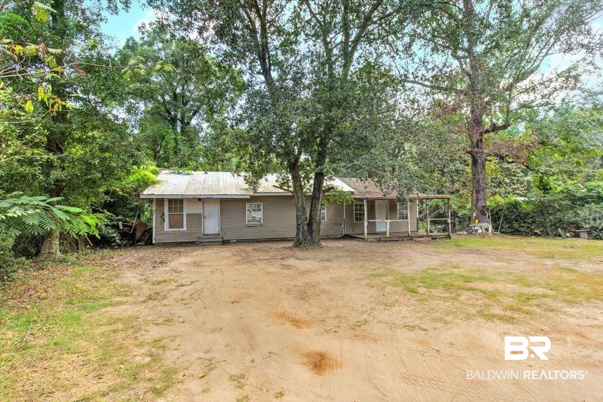 5386 Lott Road Eight Mile, AL 36613 - Photo 4 of 35 Back of property with view of wooded area