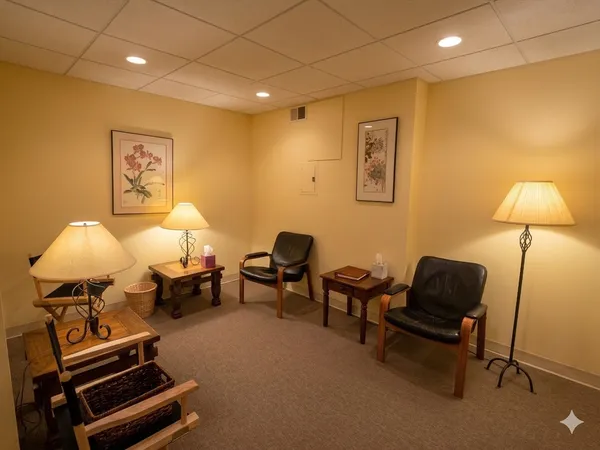 a living room with furniture and a lamp