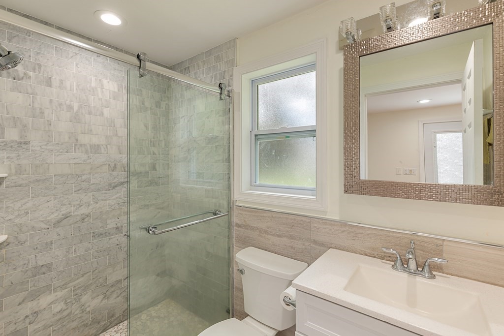 28 Standish Road Needham, MA 02492 - Photo 11 of 29 a bathroom with a sink toilet and shower