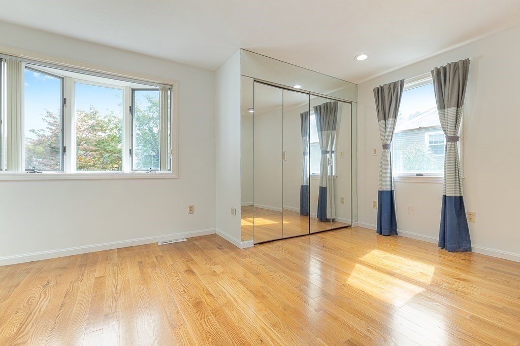 28 Standish Road Needham, MA 02492 - Photo 14 of 29 a view of an empty room with wooden floor and a window