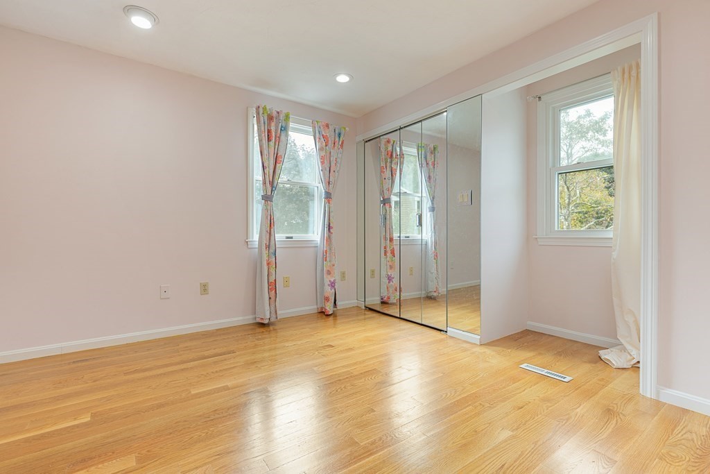 28 Standish Road Needham, MA 02492 - Photo 15 of 29 a view of an empty room with wooden floor and a window