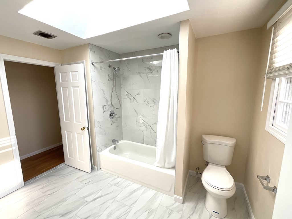28 Standish Road Needham, MA 02492 - Photo 18 of 29 a bathroom with a toilet and a shower
